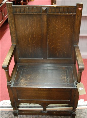 Lot 1203 - An early 20th century panelled oak single...