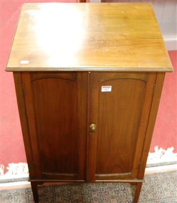 Lot 1207 - An Edwardian walnut double door music cabinet,...