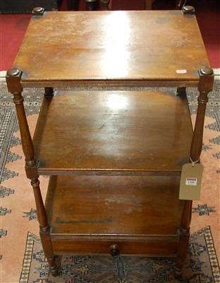 Lot 1208 - An early 19th century mahogany three-tier...