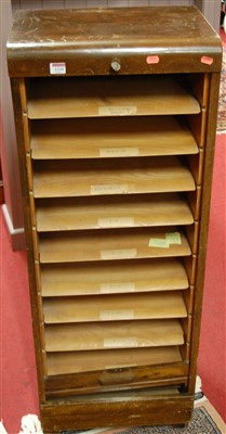 Lot 1210 - A 1930s stained ply tambour fronted narrow...