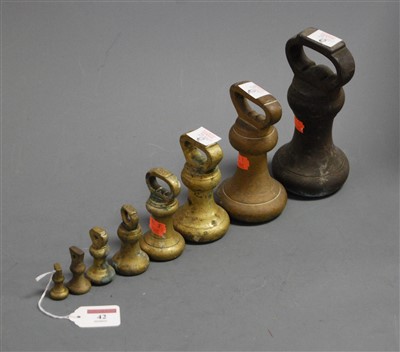 Lot 42 - Eight graduated brass bell weights