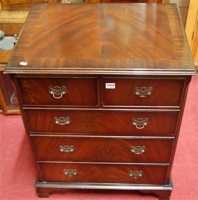 Lot 1220 - A reproduction mahogany chest of two short...