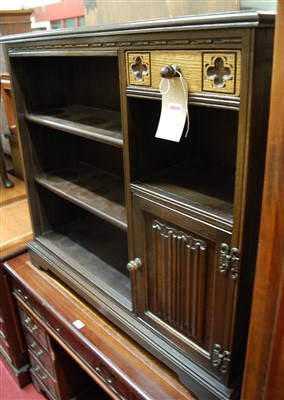 Lot 1221 - A contemporary moulded oak bookshelf, having...