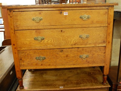 Lot 1228 - An early 20th century oak chest of three long...