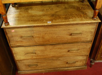 Lot 1229 - An oak utility chest of three long drawers,...