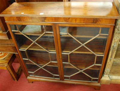 Lot 1241 - An early 20th century walnut double door...