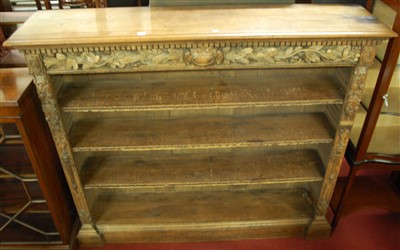Lot 1244 - A circa 1900 heavily floral carved oak...