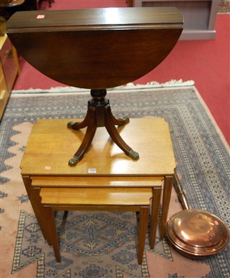 Lot 1260 - A 1970s teak nest of three occasional tables,...