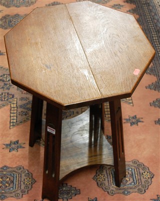 Lot 1264 - An Arts & Crafts oak octagonal topped two tier...
