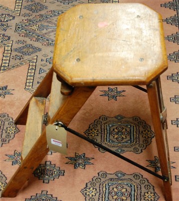 Lot 1265 - An early 20th century light oak folding set of...