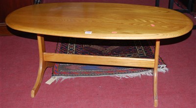 Lot 1288 - A contemporary blond elm oval coffee table,...