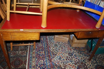 Lot 1299 - An Art Deco oak and red rexine inset library...
