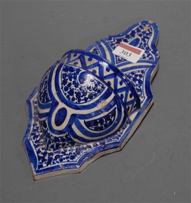 Lot 303 - A 19th century glazed earthenware wall pocket...