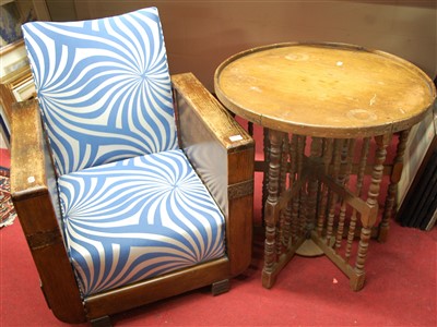 Lot 1074 - A 1930s oak framed armchair; together with a...