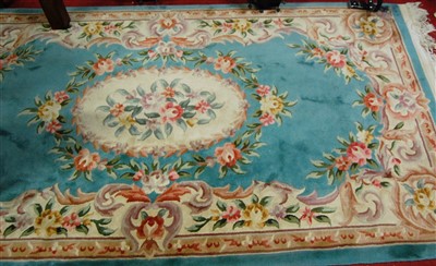 Lot 1132 - A Chinese Superwash green ground rug,...