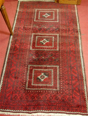 Lot 1131 - A Persian woollen rug, having a rust coloured...