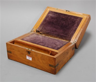 Lot 545 - A Victorian walnut and brass bound writing...