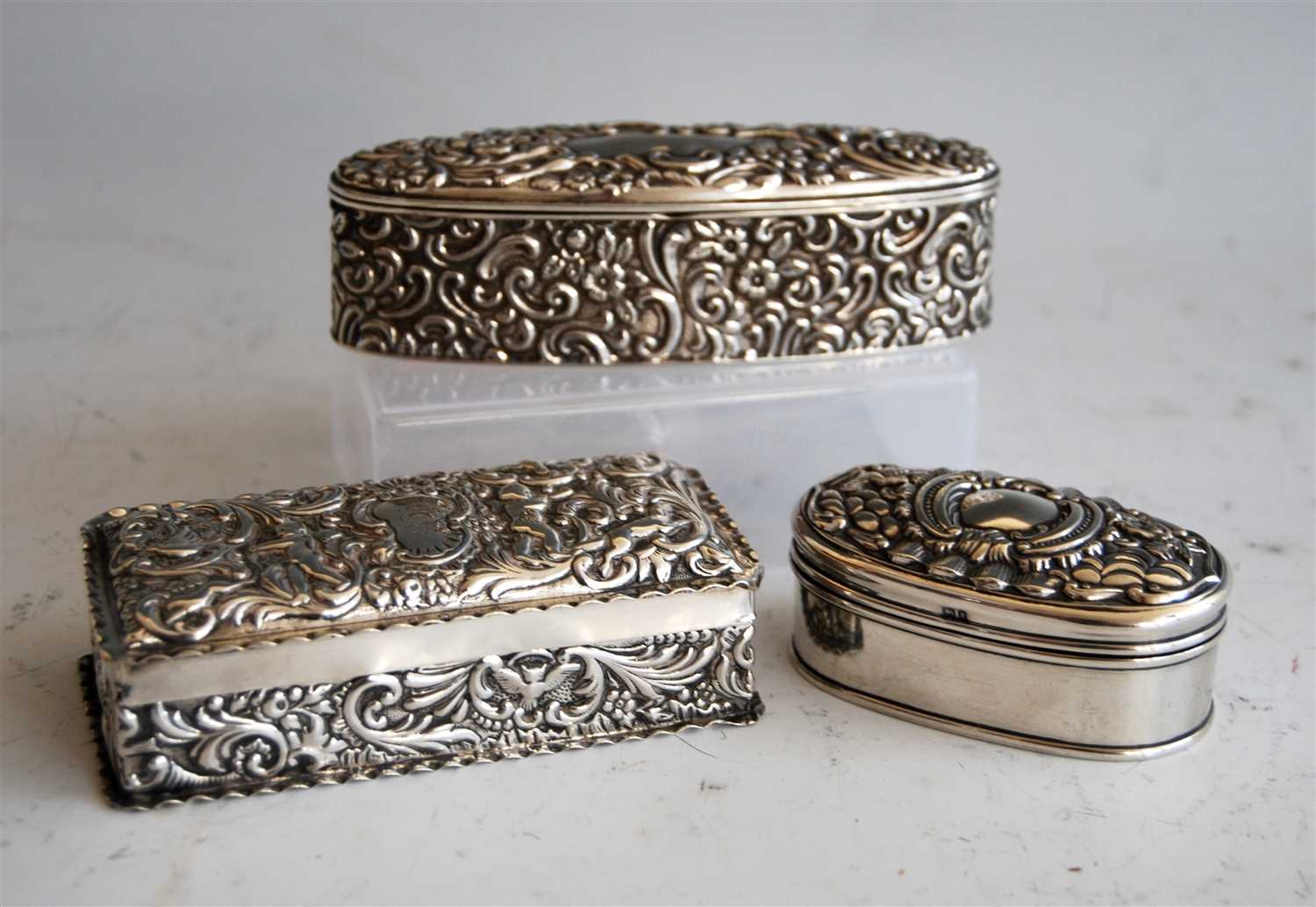 Lot 1077 - A late Victorian silver and embossed dressing...