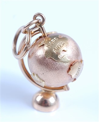 Lot 2581 - An 18ct yellow gold 3 dimensional globe charm...