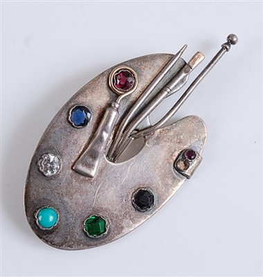 Lot 2549 - A white metal brooch in the form of an...