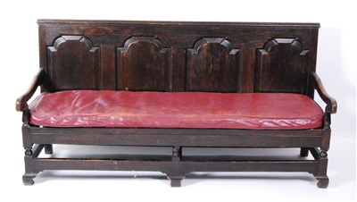 Lot 1395 - A George III oak settle, the rectangular back...