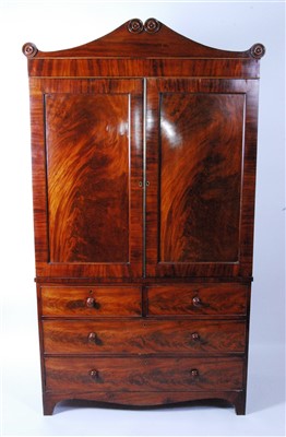 Lot 1400 - A George IV mahogany linenpress, having a...