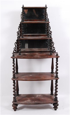 Lot 1411 - A Victorian walnut six-tier whatnot, the...