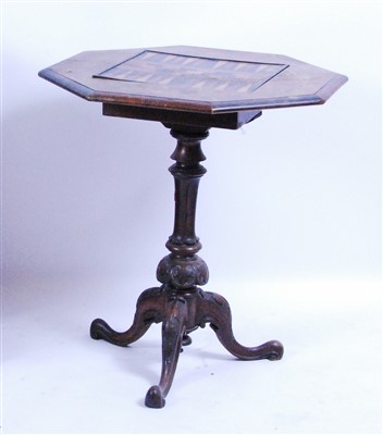 Lot 1415 - A Victorian figured walnut tripod games table,...