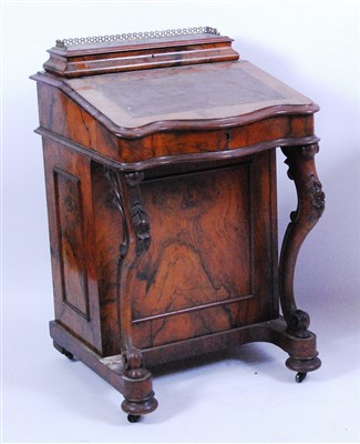 Lot 1414 - A Victorian figured walnut kneehole writing...