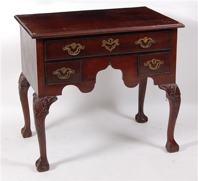 Lot 1456 - A George III mahogany lowboy, the top having a...