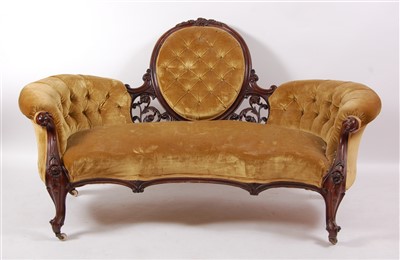 Lot 1465 - A Victorian rosewood framed settee, having a C-...
