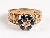 Lot 2571 - A 9ct yellow gold, sapphire and diamond...