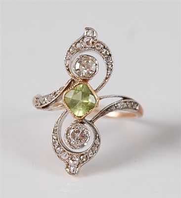 Lot 1206 - A yellow and white metal peridot and diamond...