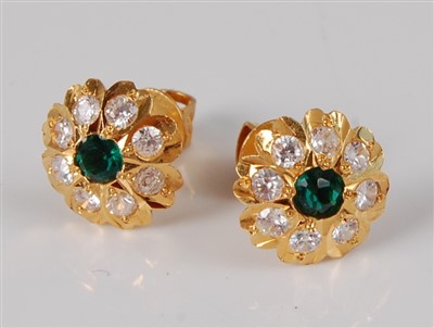 Lot 1182 - A pair of 22ct gold, synthetic emerald and...