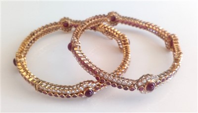 Lot 1208 - A pair of yellow metal, ruby and diamond...