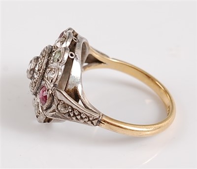 Lot 1193 - An 18ct and platinum diamond, ruby and emerald...
