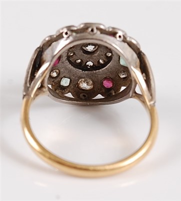 Lot 1193 - An 18ct and platinum diamond, ruby and emerald...