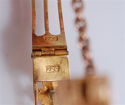 Lot 1194 - A late Victorian yellow metal hinged bangle,...
