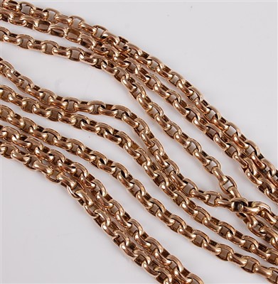 Lot 1197 - A yellow metal guard chain, oval belcher link...