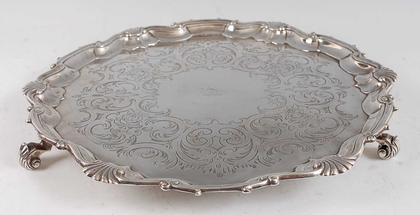 Lot 1079 - A George II silver salver, having floral and C-...