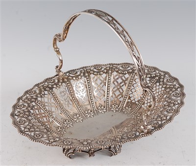Lot 1085 - A George V silver basket, of pierced oval form...