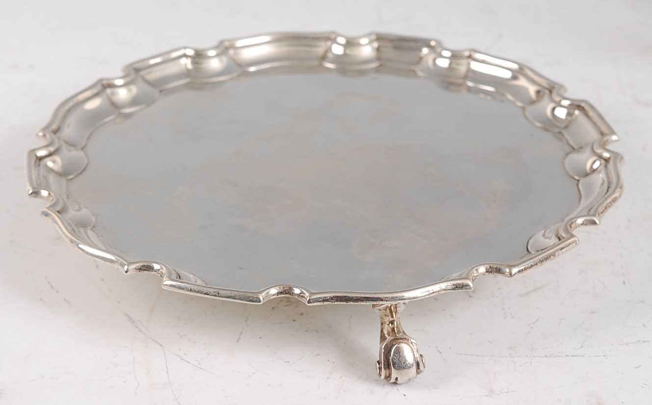 Lot 1113 - A modern silver card waiter, in the Georgian...