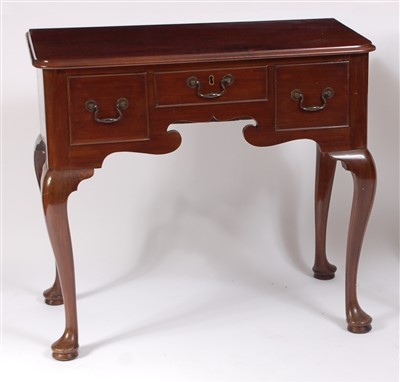 Lot 1473 - A circa 1900 mahogany lowboy, in the early...