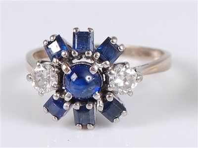 Lot 1213 - A yellow and white metal, sapphire and diamond...