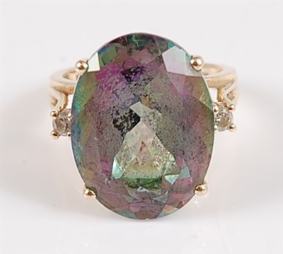Lot 2561 - A yellow metal oval 'mystic topaz' and diamond...