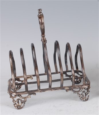 Lot 1140 - An early Victorian silver six-division toast...