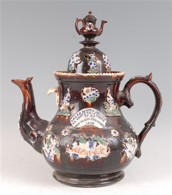 Lot 1043 - A Victorian Meacham / bargeware treacle glazed...