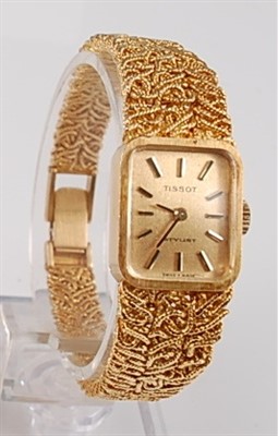 Lot 1251 - An 18ct yellow gold lady's Tissot manual wind...