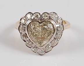 Lot 1226 - An 18ct yellow and white gold heart shaped...