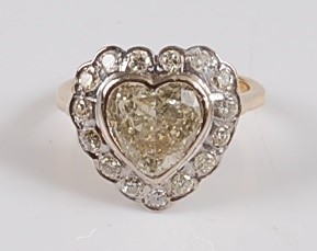 Lot 1226 - An 18ct yellow and white gold heart shaped...